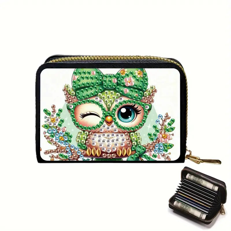 Decorative wallet with owl design and gemstones on a white background