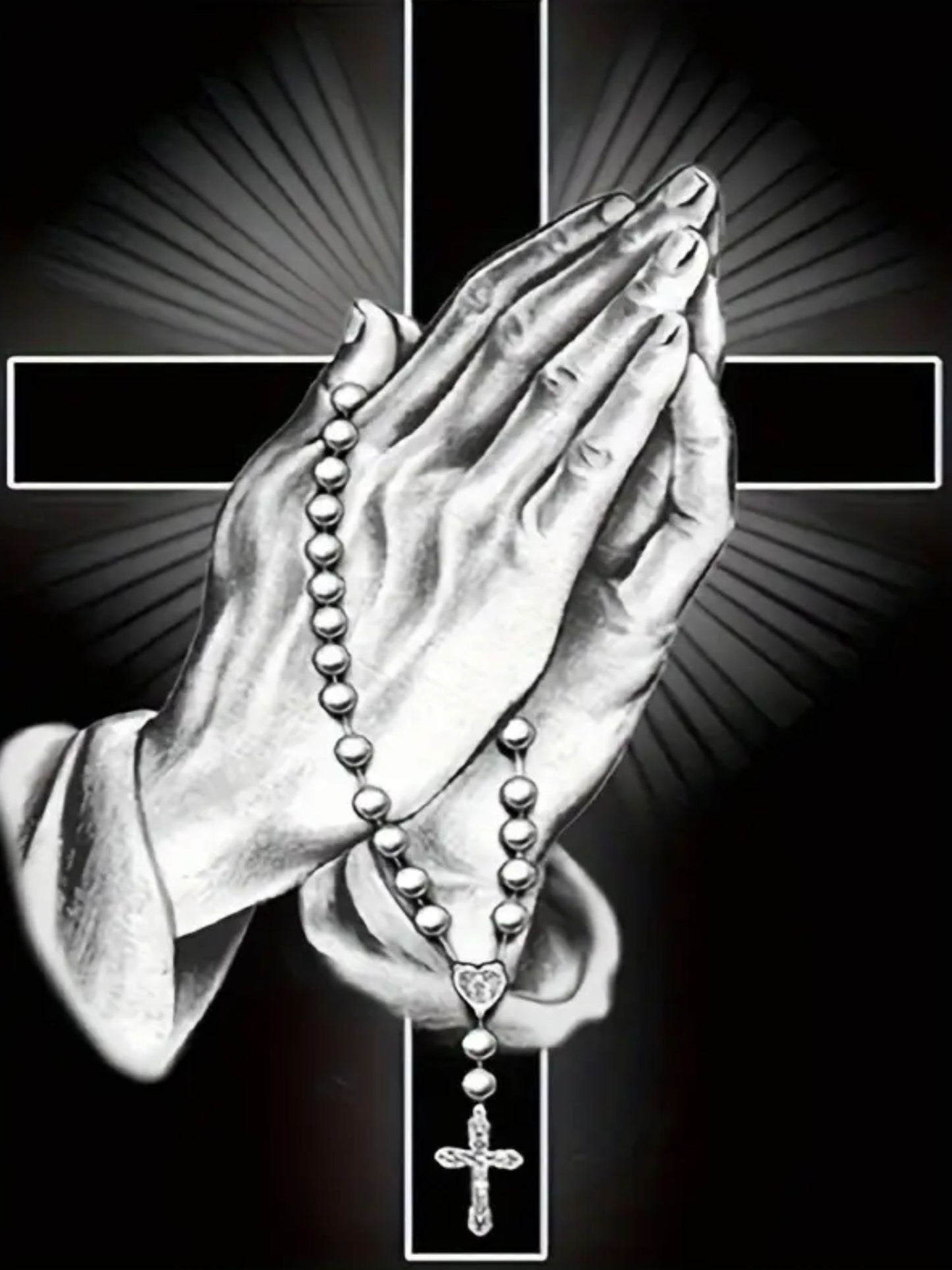 A diamond art kit depicting a pair of hands in a praying position holding a rosary with a cross in the background, symbolizing faith and devotion.