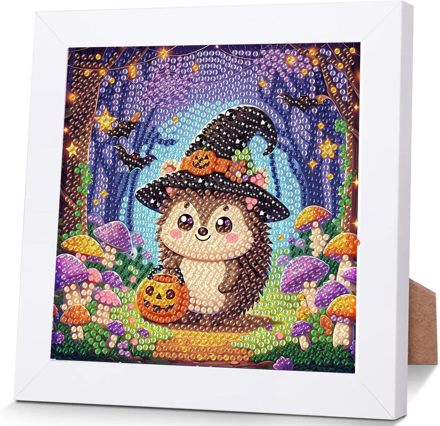 Decorative panel with a hedgehog wearing a witch hat and pumpkin, surrounded by mushrooms and flowers, framed in white.