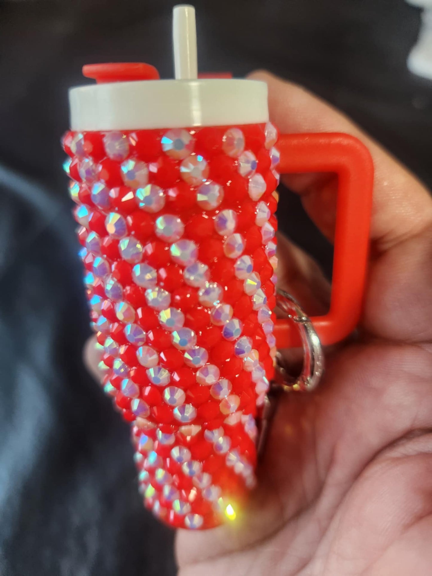 A blinged mini chapstick holder keychain with a purple and silver bead design, featuring a twist-off lid and a keychain attachment.