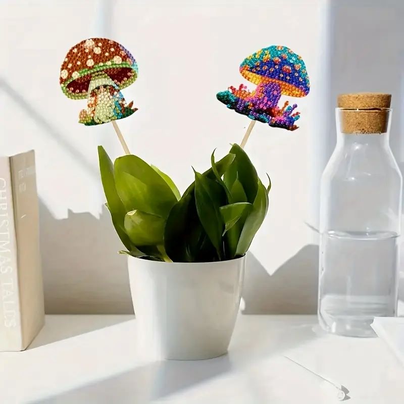Decorative diamond art mushroom plant sticks in a pot with a water bottle in the background