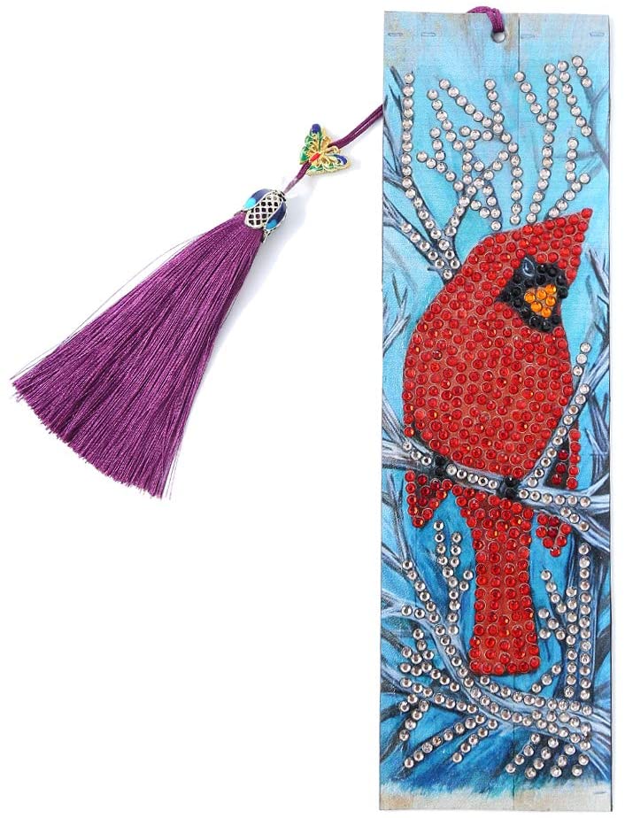 Diamond painting bookmark with a red cardinal on a branch, a purple tassel, and a butterfly charm.