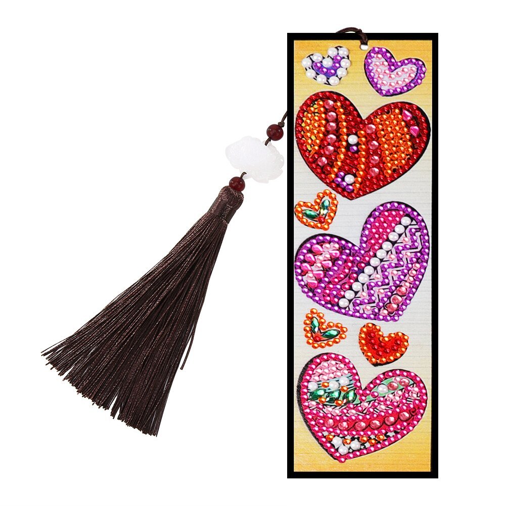 Diamond painting bookmark with various colorful hearts and a brown tassel with white beads.