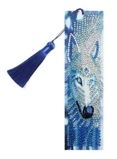 Diamond painting bookmark with a blue and white wolf face and a deep blue tassel.