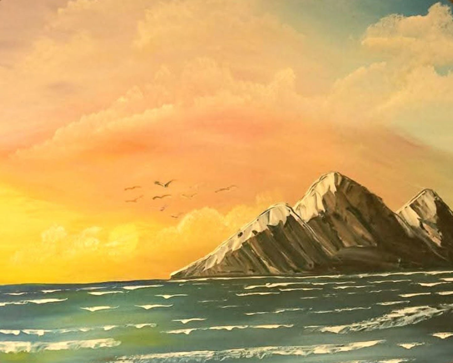 Mountain peak with a sunset sky and clouds