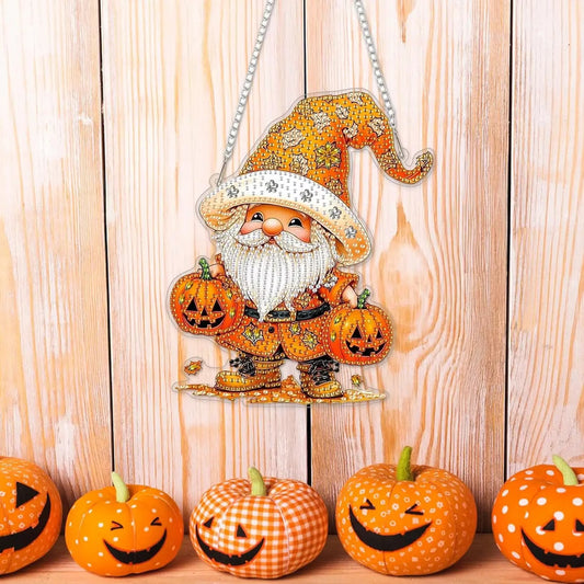 Decorative Halloween gnome with pumpkins on a wooden background