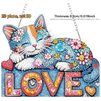 A colorful rhinestone-style decorative sign shaped like a sleeping cat resting on the word LOVE. The design features many bright floral and heart motifs, with text reading '2D plane, not 3D' and 'Thickness 0.