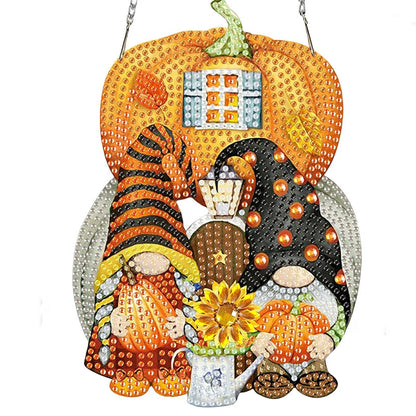 Decorative pumpkin-shaped plaque with Halloween-themed design on a white background