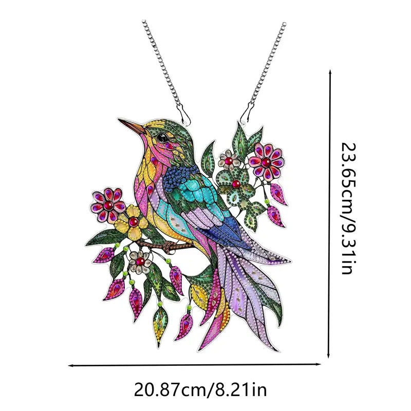 Colorful bird-shaped pendant with floral elements on a white background