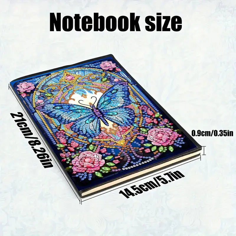 Notebook with butterfly and floral design, showing dimensions on a white background