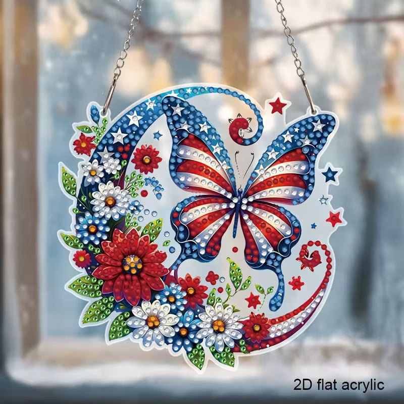 A round 2D flat acrylic diamond painting sun catcher featuring a butterfly with star and stripe wings surrounded by red and white flowers.