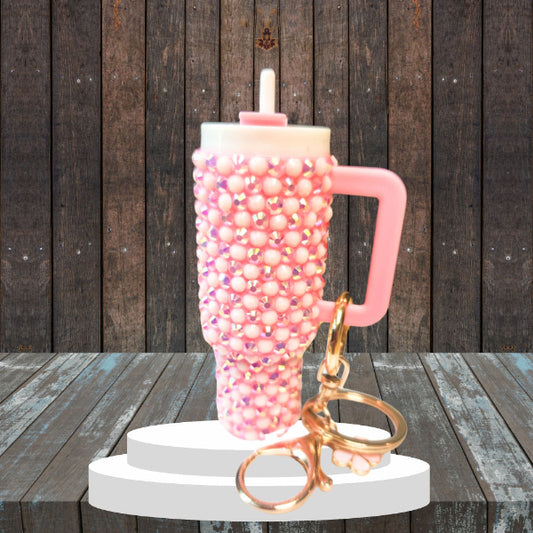 A blinged mini chapstick holder keychain with a purple and silver bead design, featuring a twist-off lid and a keychain attachment.