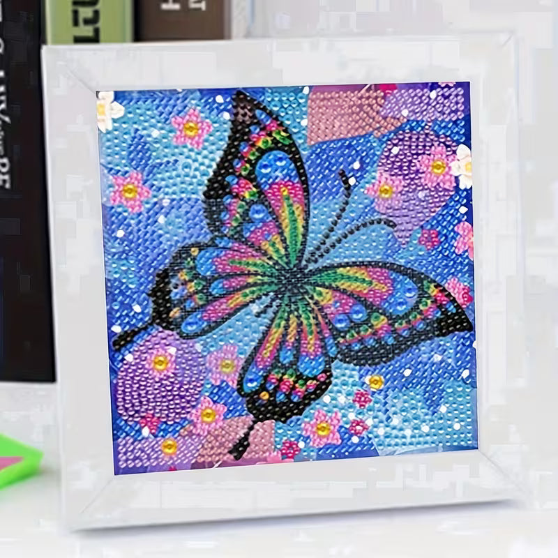 Colorful butterfly artwork on a blue background with flowers, framed in white.