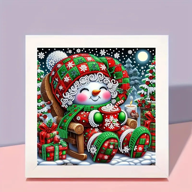 Decorative diamond painting of a snowman with a festive hat and scarf, sitting on a sleigh with presents.
