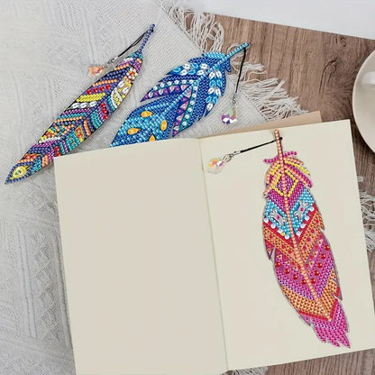 Colorful beaded feather bookmarks on a wooden surface with a book open below.