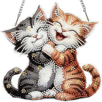 Two cats, one black and white and one orange and white, sitting together on a clear background.