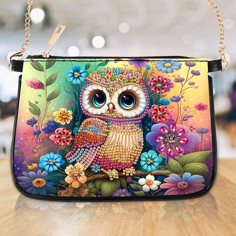 Colorful handbag with an owl and floral design on a blurred background