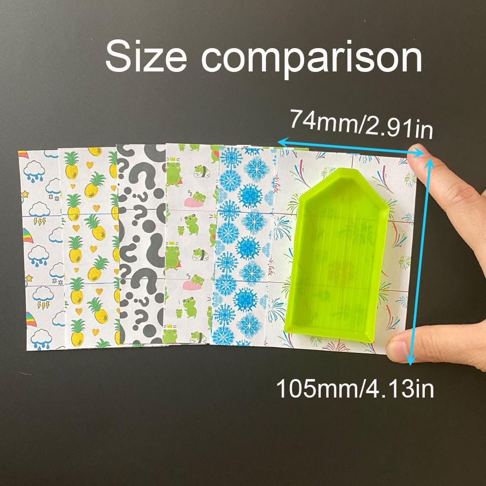 Size comparison of a green plastic tool with a patterned cover paper for diamond painting