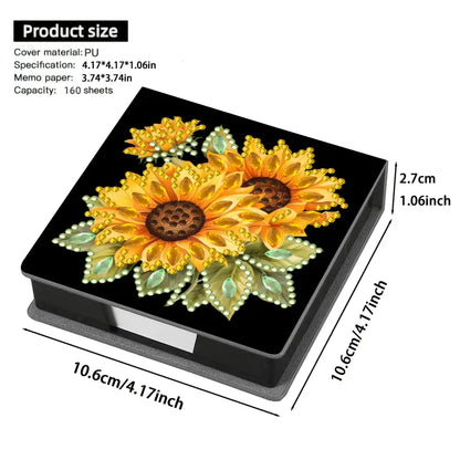A Diamond Painting Notepad Box with a sunflower design on the lid, decorated with colorful crystal rhinestones.